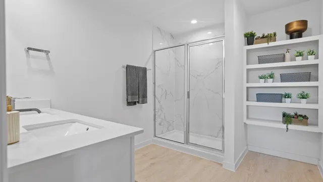 a bathroom with a bathtub and a sink