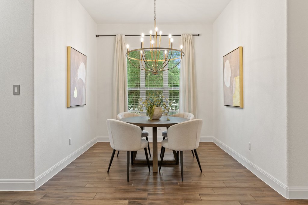 17641 Stratus Cove Dripping Springs, TX 78620 - Photo 15 of 40 Dining space featuring wood finished floors and hanging lights