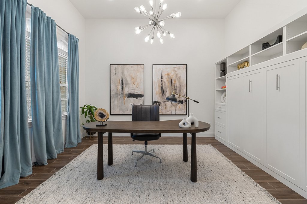 17641 Stratus Cove Dripping Springs, TX 78620 - Photo 8 of 40 Home office with wood tiled floors and suspended lighting
