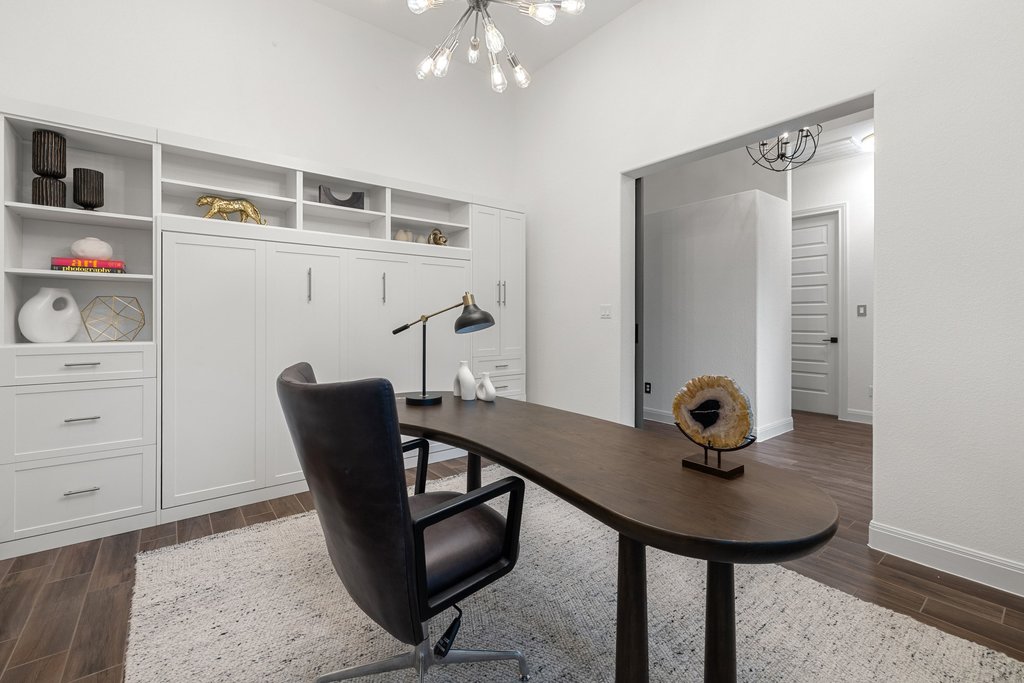 17641 Stratus Cove Dripping Springs, TX 78620 - Photo 9 of 40 Office area with hanging lights, wood tiled floors, and a high ceiling