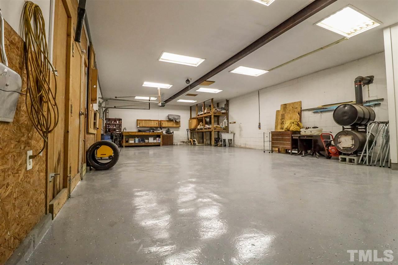 7745 Rock Quarry Road Raleigh, NC 27610 - Photo 23 of 25 Garage/Workshop equipped with a half bath.