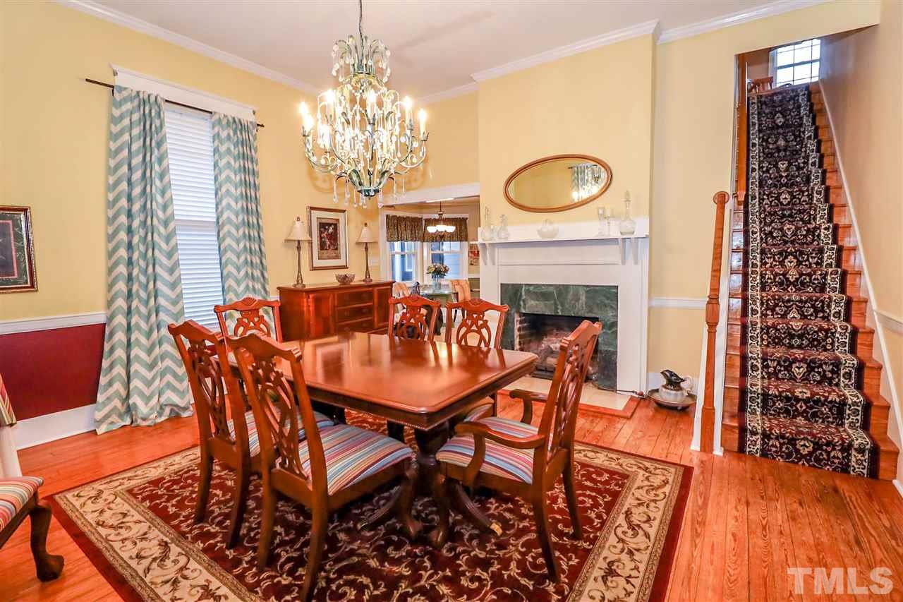 7745 Rock Quarry Road Raleigh, NC 27610 - Photo 8 of 25 A pleasingly graceful formal dining space entertained by a functional propane gas fireplace. Original hardwood flooring and 10ft ceilings.