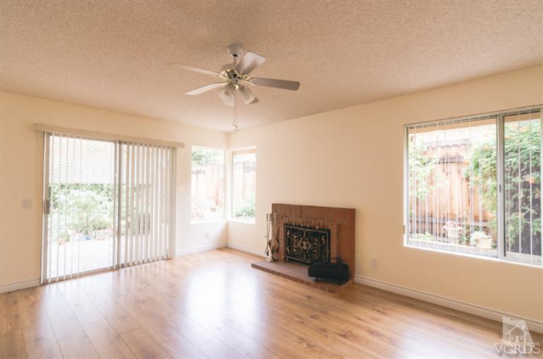 1757 Old Ranch Road Camarillo, CA 93012 - Photo 12 of 39 a view of an empty room with wooden floor and a window