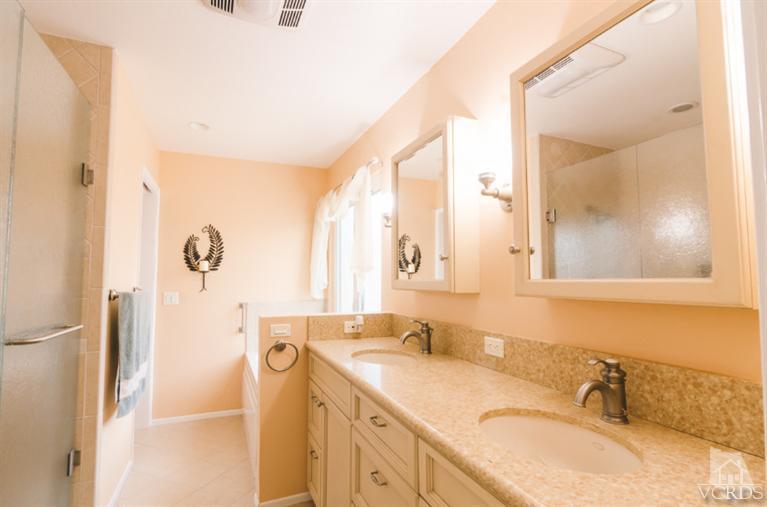 1757 Old Ranch Road Camarillo, CA 93012 - Photo 19 of 39 a bathroom with a granite countertop sink mirror and a shower