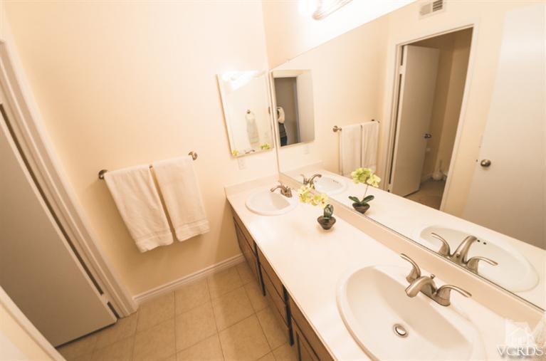 1757 Old Ranch Road Camarillo, CA 93012 - Photo 22 of 39 a bathroom with a sink and a mirror