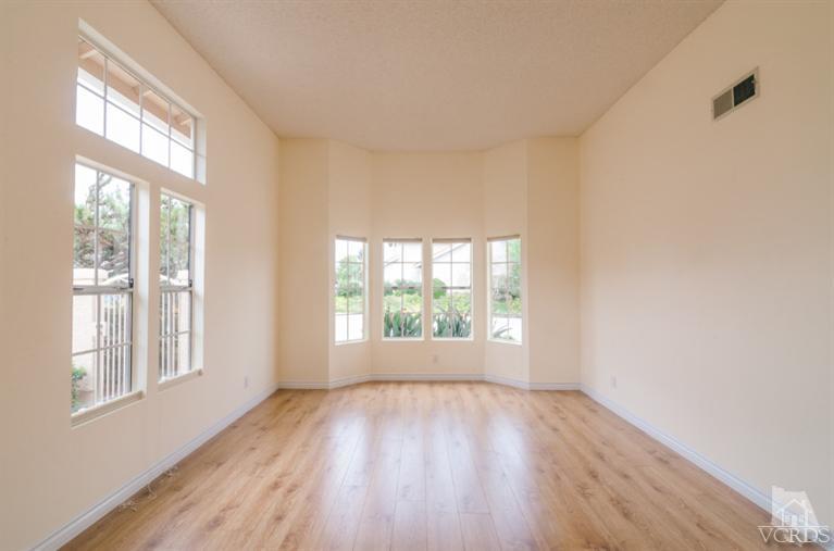 1757 Old Ranch Road Camarillo, CA 93012 - Photo 6 of 39 an empty room with wooden floor and windows