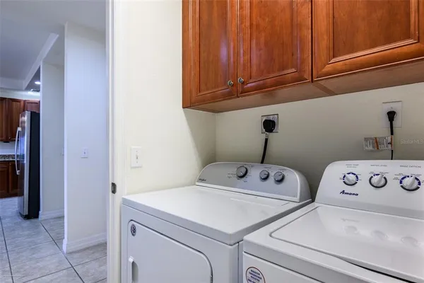 a bathroom with a granite countertop sink toilet mirror and bathtub