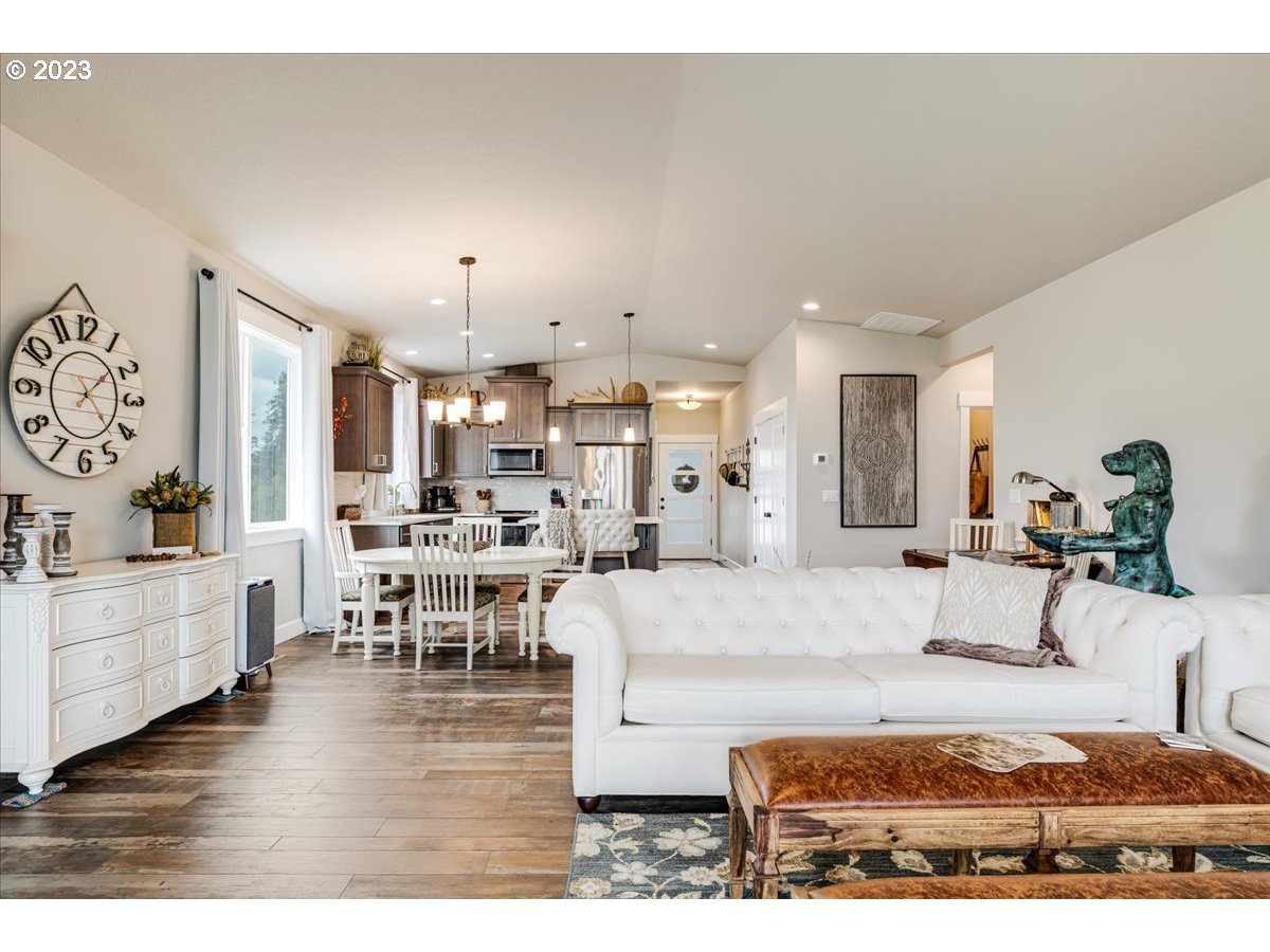 133 Northeast Regan Hill Loop Estacada, OR 97023 - Photo 12 of 29 a living room with furniture and a wooden floor
