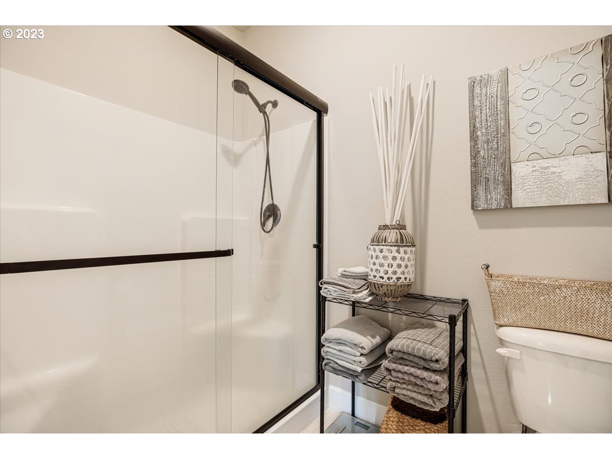 133 Northeast Regan Hill Loop Estacada, OR 97023 - Photo 16 of 29 a bathroom with a shower and a toilet