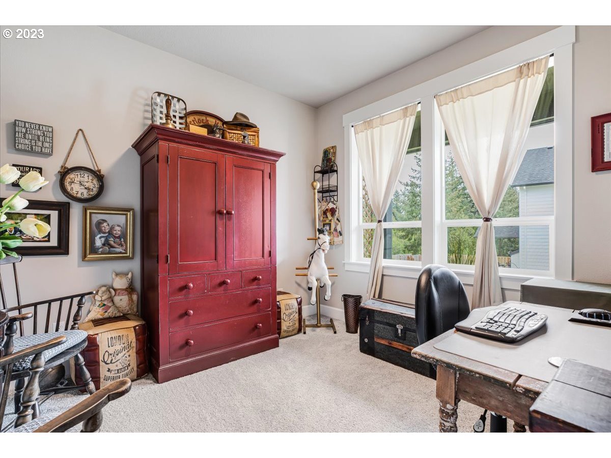 133 Northeast Regan Hill Loop Estacada, OR 97023 - Photo 17 of 29 a bedroom with furniture and a window