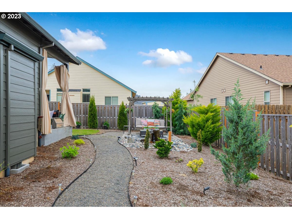 133 Northeast Regan Hill Loop Estacada, OR 97023 - Photo 27 of 29 a view of a porch with chairs and potted plants