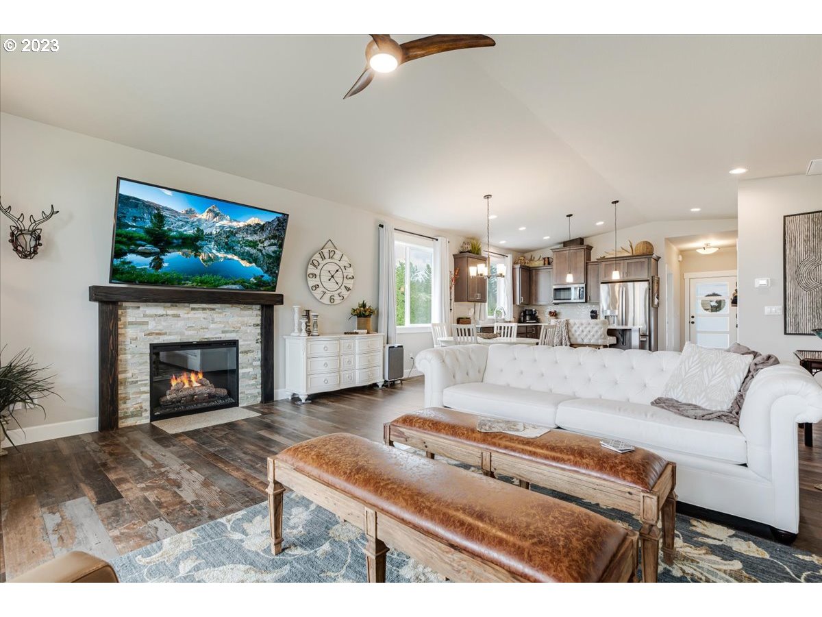 133 Northeast Regan Hill Loop Estacada, OR 97023 - Photo 9 of 29 a living room with furniture and a fireplace