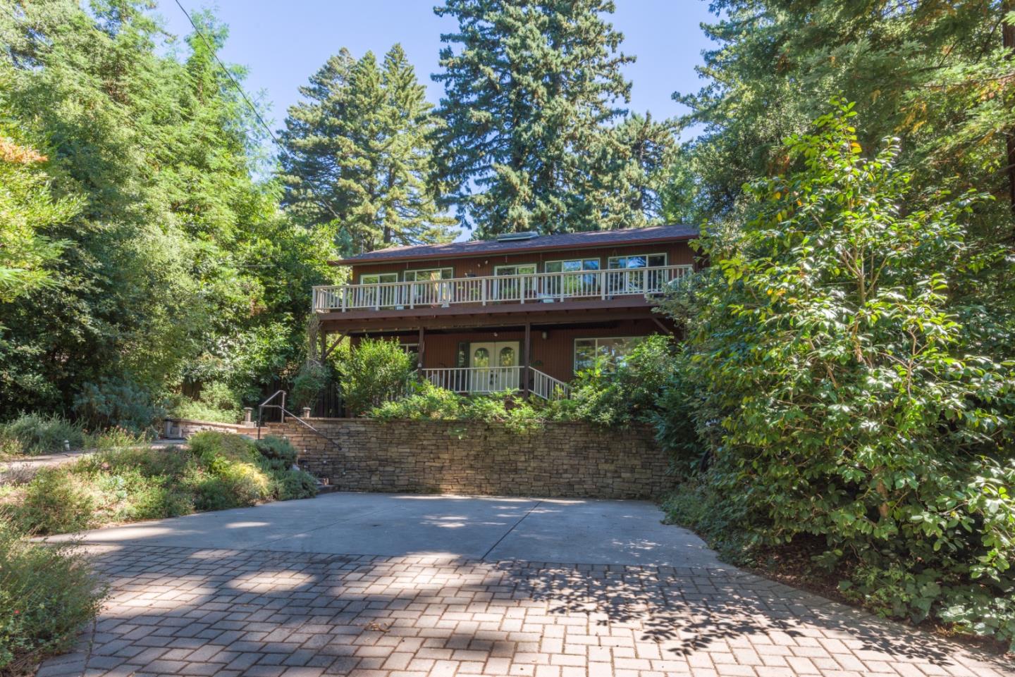 a view of a wooden house with a yard