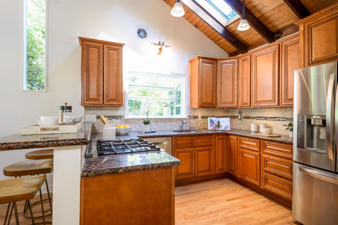 8 Big Tree Way Woodside, CA 94062 - Photo 6 of 31 a kitchen with stainless steel appliances granite countertop a sink stove and refrigerator