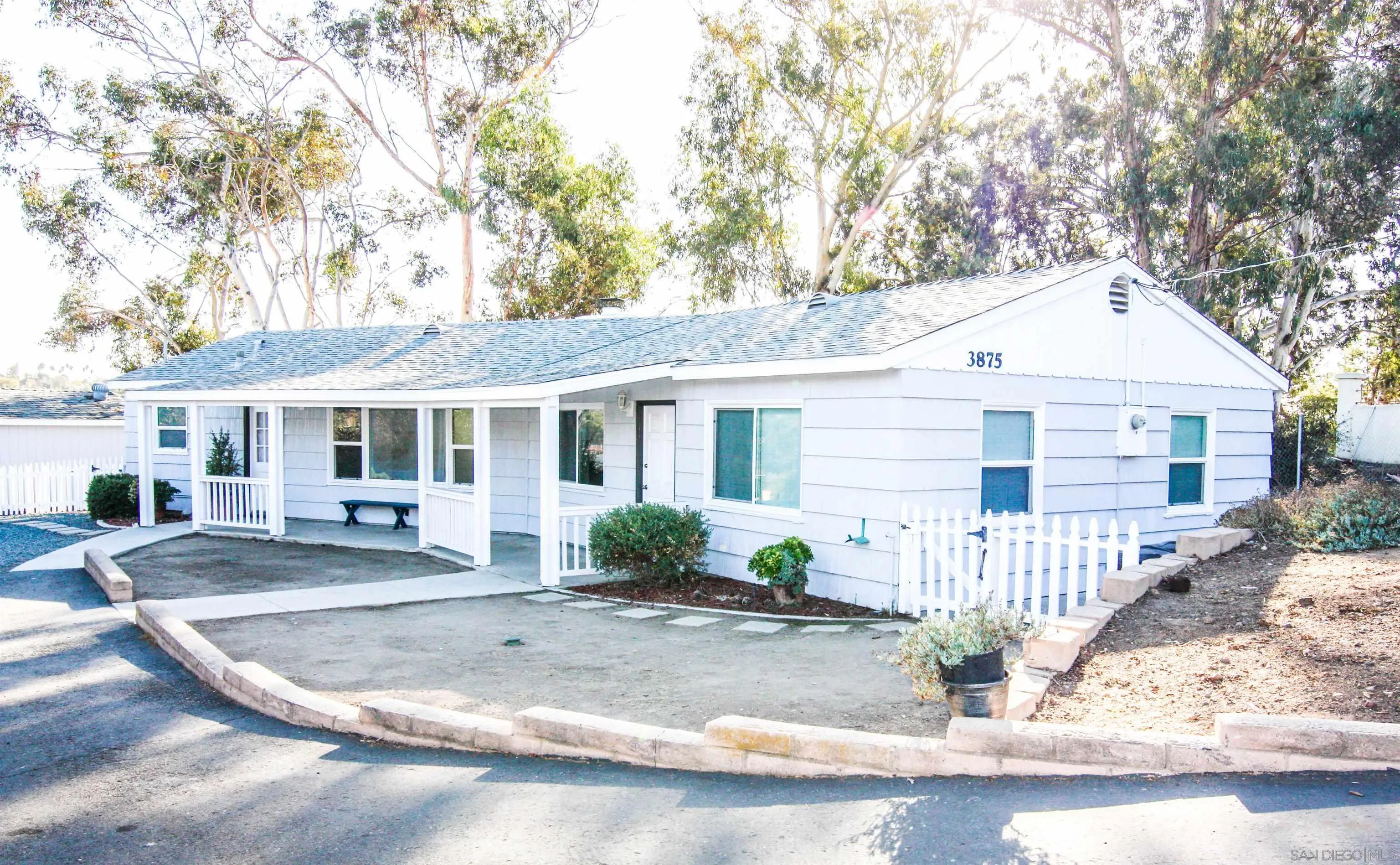 a front view of a house with a porch