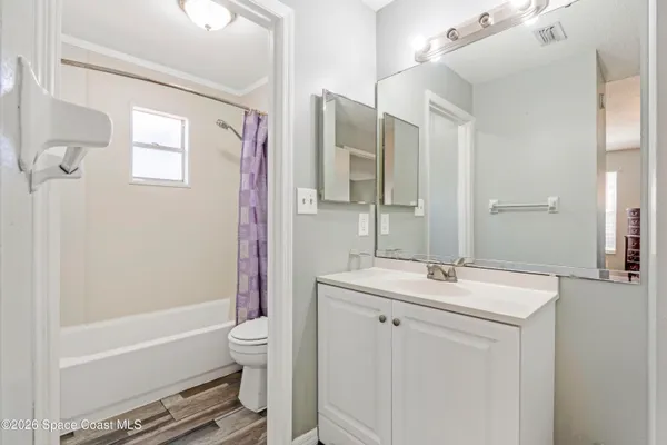 a bathroom with a sink toilet tub and shower