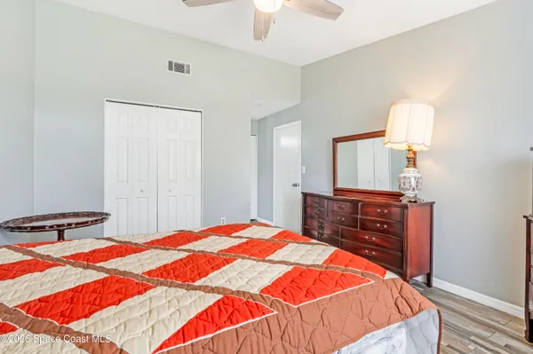 a bedroom with a bed and a dresser