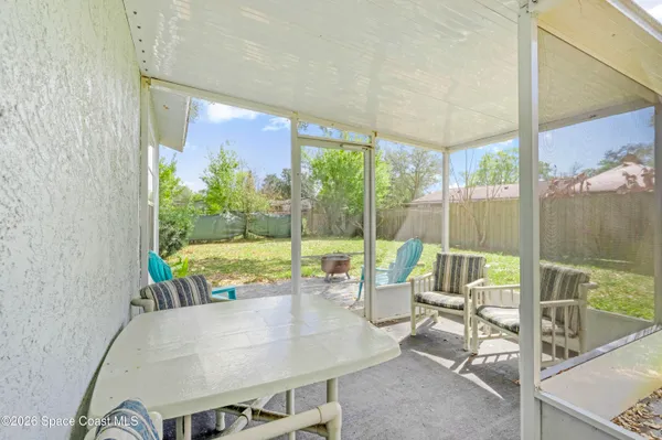 a living room with a large window and a table