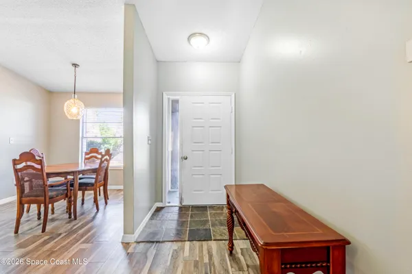 a room with furniture and wooden floor