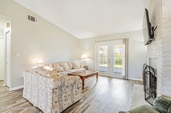 a bed room with a bed and a night stand