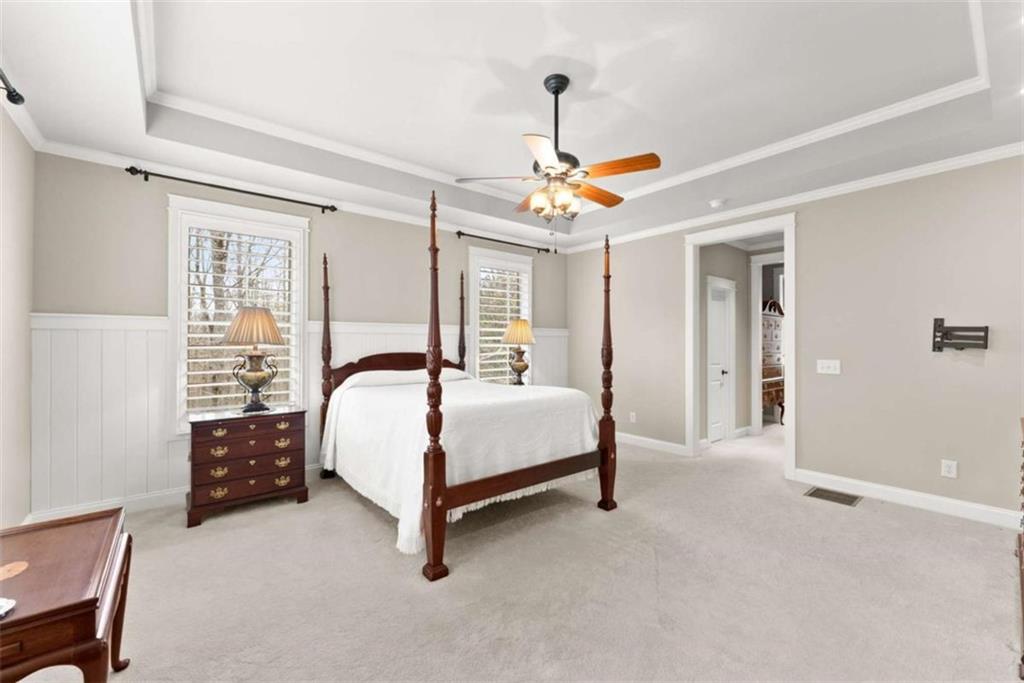 167 Early Red Pippin Clarkesville, GA 30523 - Photo 22 of 59 a bedroom with a bed and a chandelier