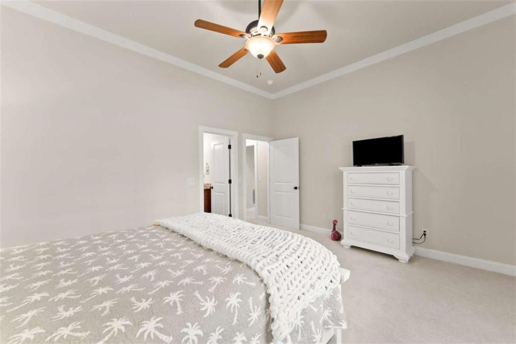 167 Early Red Pippin Clarkesville, GA 30523 - Photo 39 of 59 a bedroom with a bed and a ceiling fan