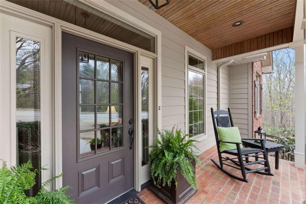 167 Early Red Pippin Clarkesville, GA 30523 - Photo 4 of 59 a view of a porch with chairs and potted plants