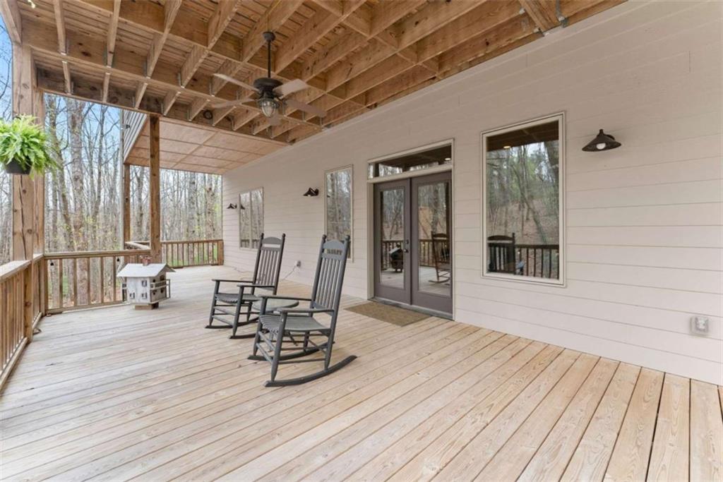 167 Early Red Pippin Clarkesville, GA 30523 - Photo 42 of 59 a view of a patio with table and chairs with wooden floor and fence