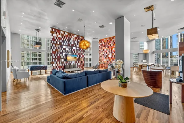 a living room with fireplace furniture and a wooden floor