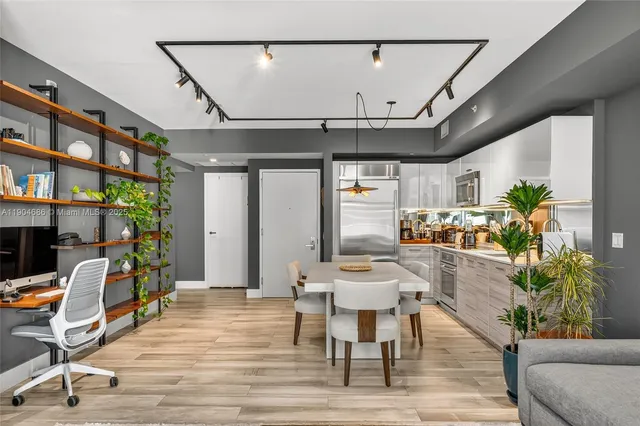 a view of a livingroom with furniture and a potted plant