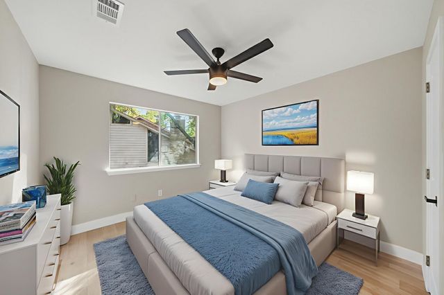 a bedroom with a large bed and a window