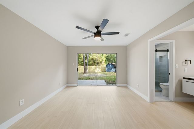 a view of n empty room with a window