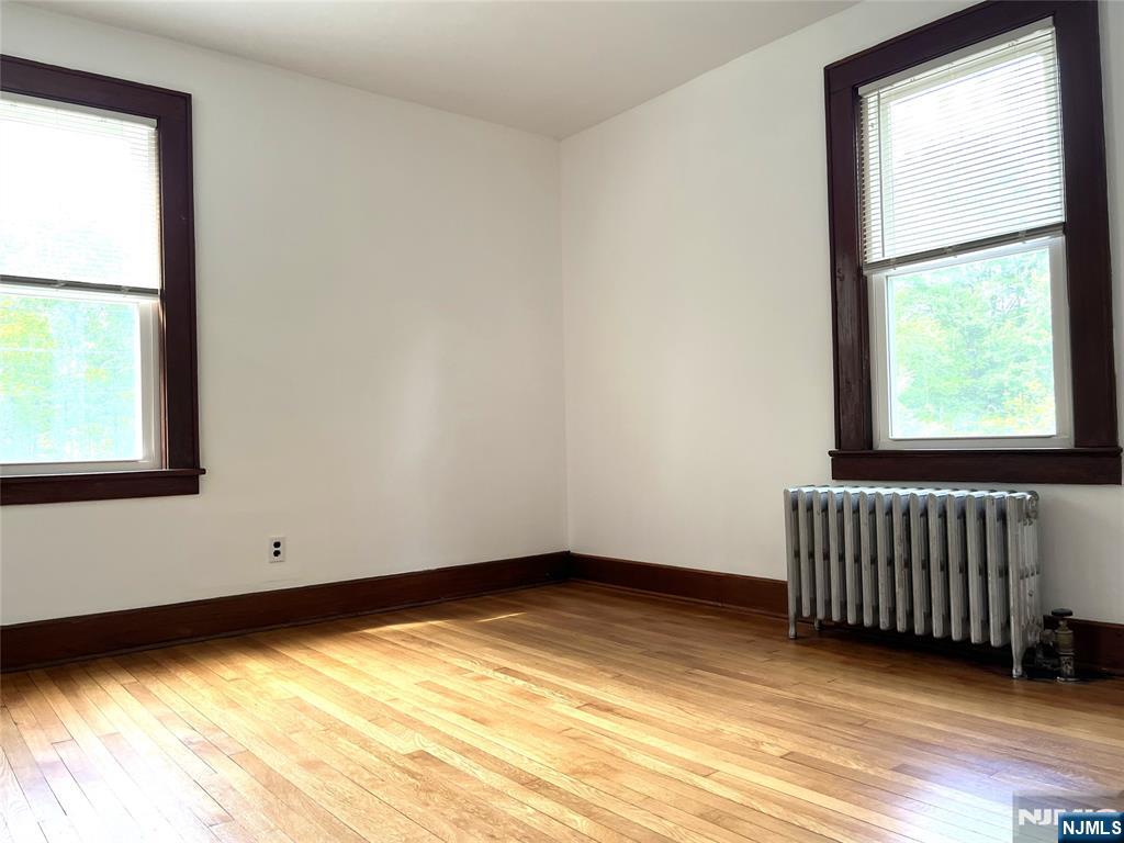 1156 High Mountain Road North Haledon, NJ 07508 - Photo 7 of 14 a view of an empty room with wooden floor and a window
