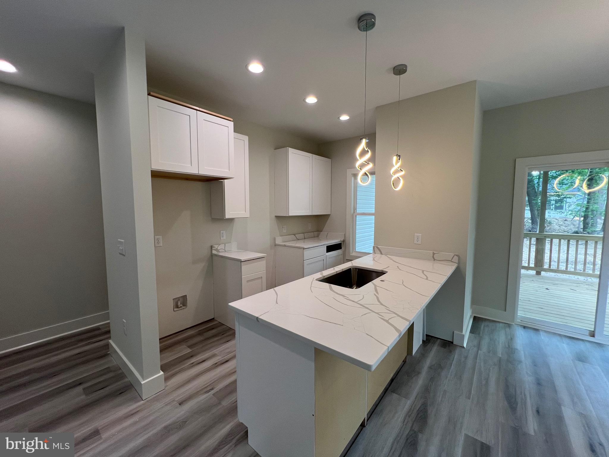 175 Rose Way Colonial Beach, VA 22443 - Photo 11 of 33 a kitchen with a sink and cabinets