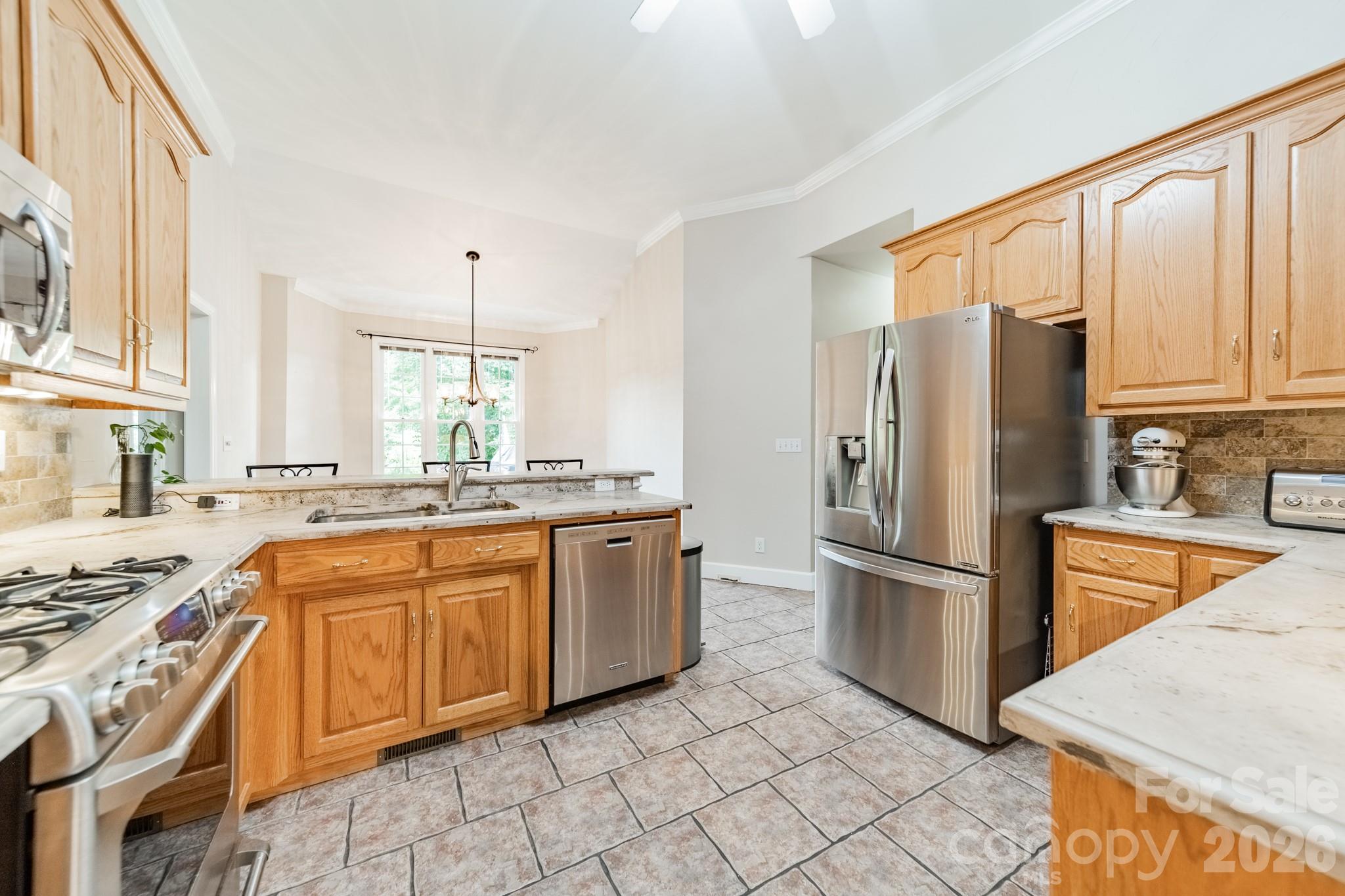 7545 Rabbit Circle Denver, NC 28037 - Photo 12 of 37 a kitchen with stainless steel appliances granite countertop a refrigerator stove and sink