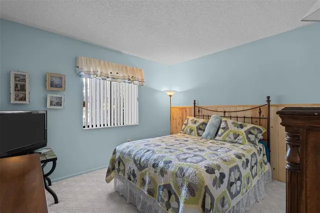 a bedroom with a bed and a cabinets