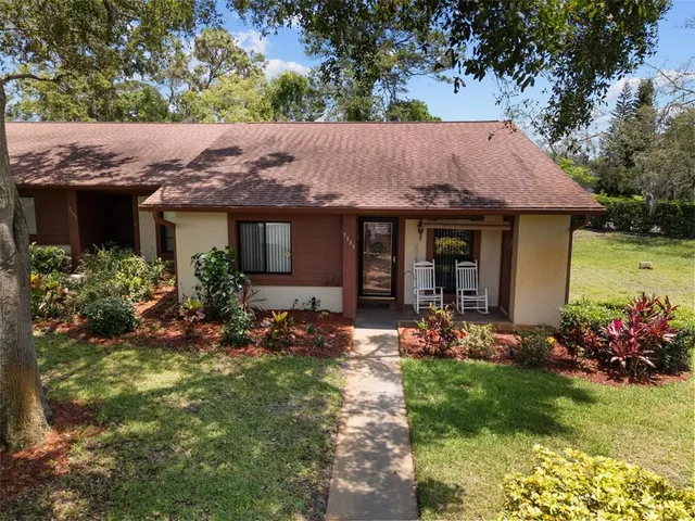an aerial view of house with yard