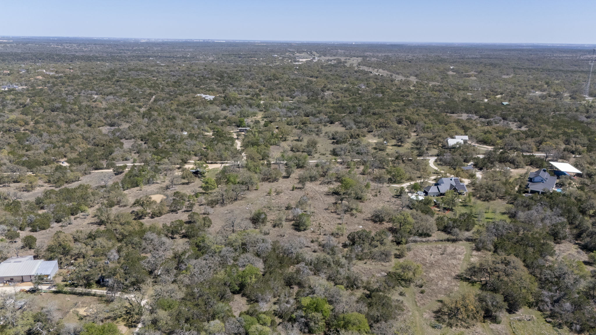 453 Nameless Road Driftwood, TX 78619 - Photo 11 of 35 an aerial view of house with yard and mountain view in back