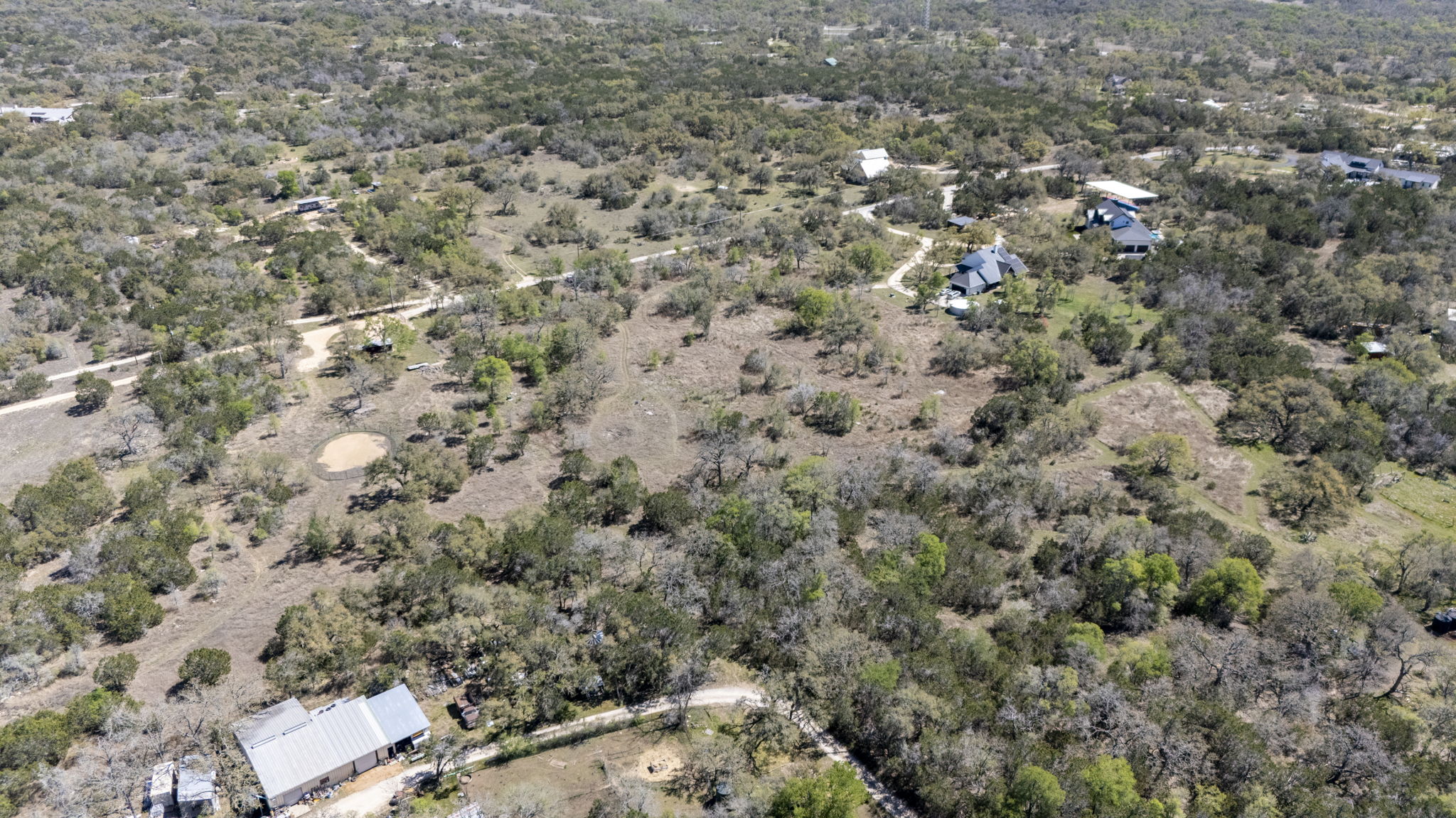 453 Nameless Road Driftwood, TX 78619 - Photo 12 of 35 a view of a city with lush green forest