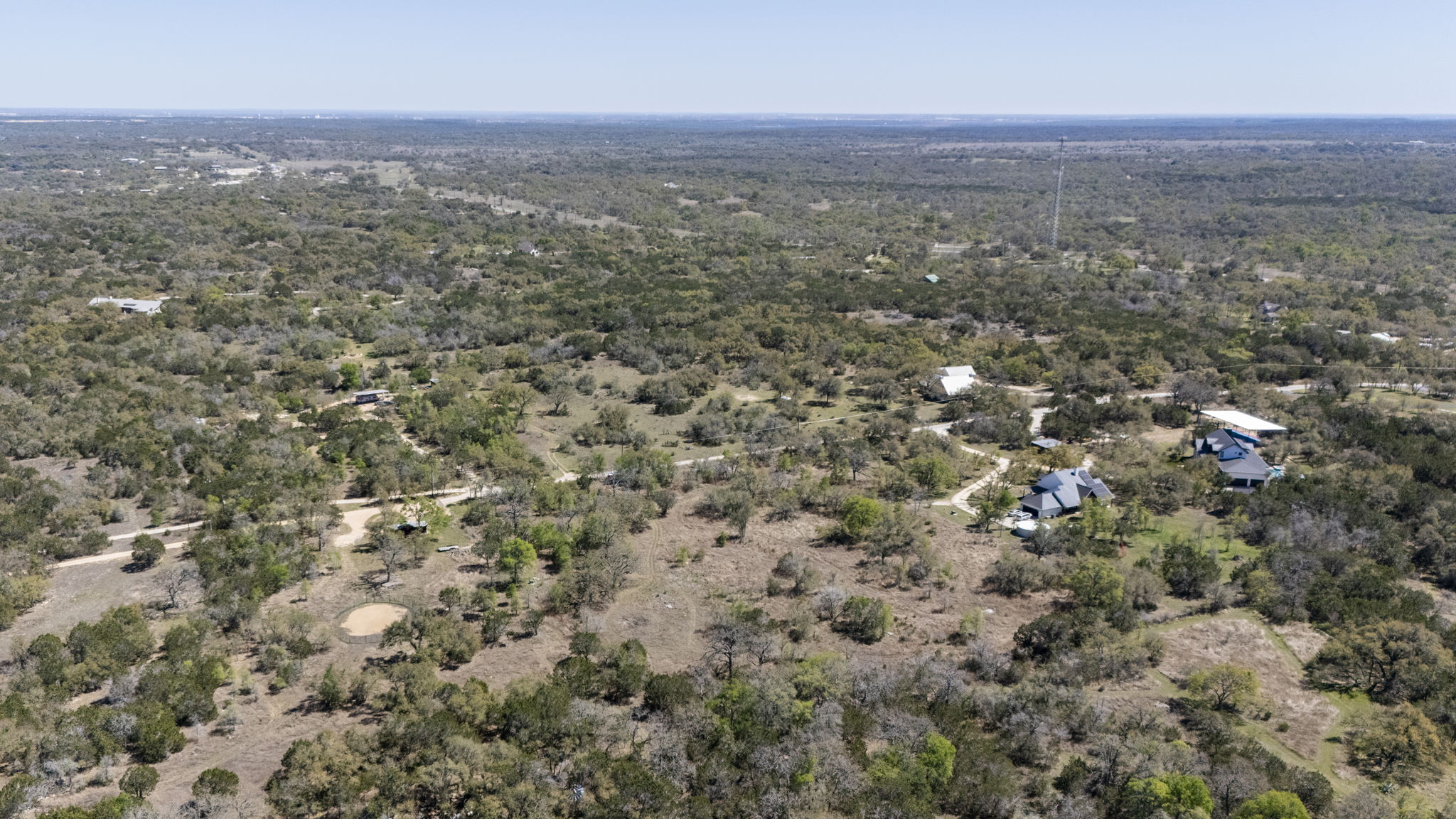 453 Nameless Road Driftwood, TX 78619 - Photo 13 of 35 an aerial view of house with yard and mountain view in back