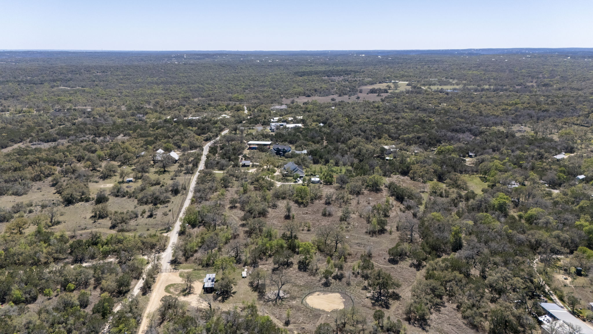 453 Nameless Road Driftwood, TX 78619 - Photo 15 of 35 an aerial view of house with yard and mountain view in back