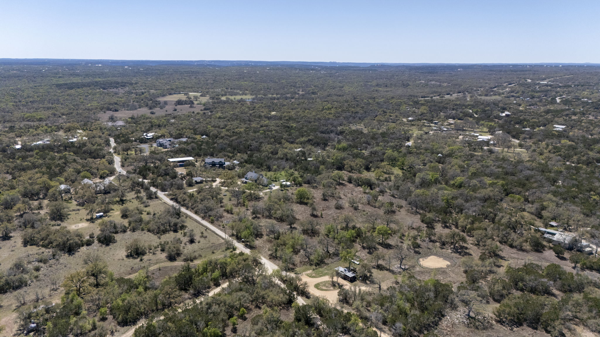 453 Nameless Road Driftwood, TX 78619 - Photo 16 of 35 an aerial view of house with yard and mountain view in back