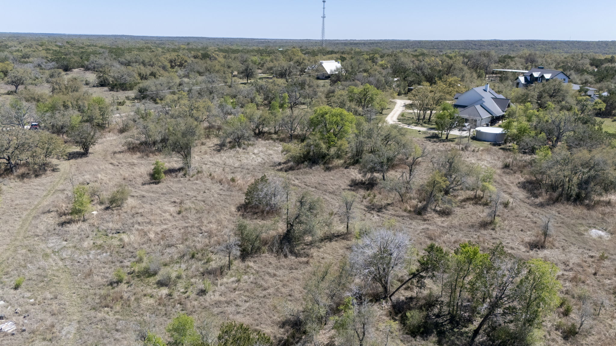 453 Nameless Road Driftwood, TX 78619 - Photo 24 of 35 a view of a dry field with lots of trees