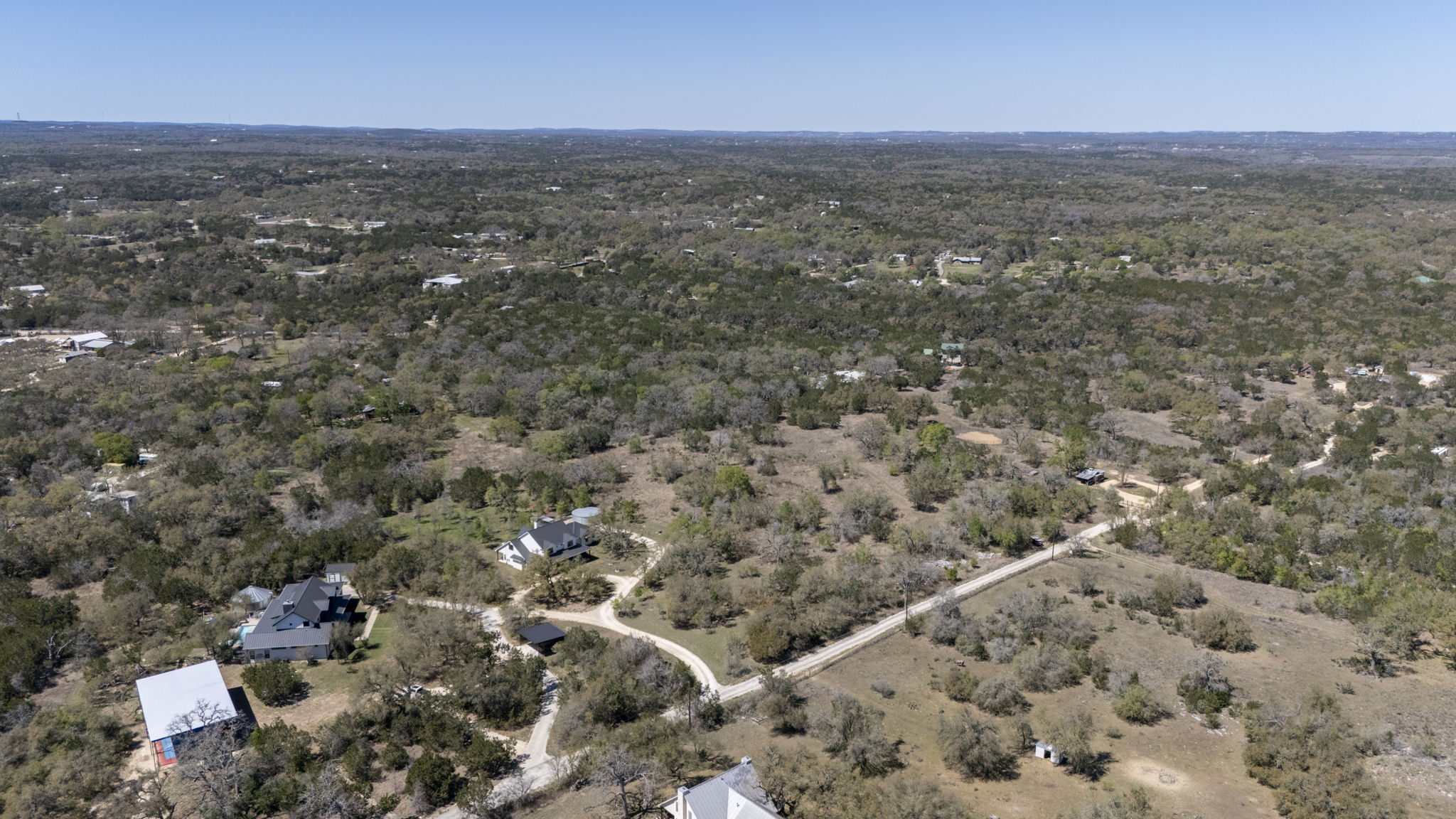 453 Nameless Road Driftwood, TX 78619 - Photo 3 of 35 an aerial view of house with yard and mountain view in back