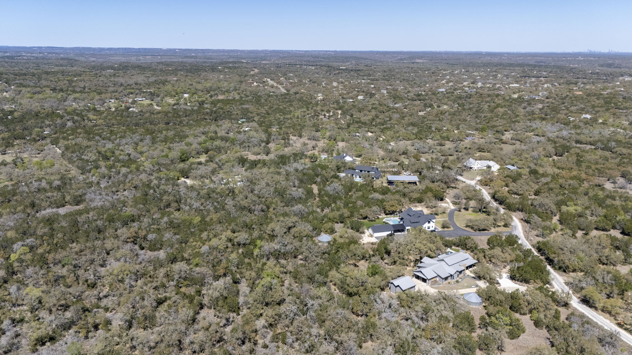 453 Nameless Road Driftwood, TX 78619 - Photo 6 of 35 an aerial view of residential houses with city view