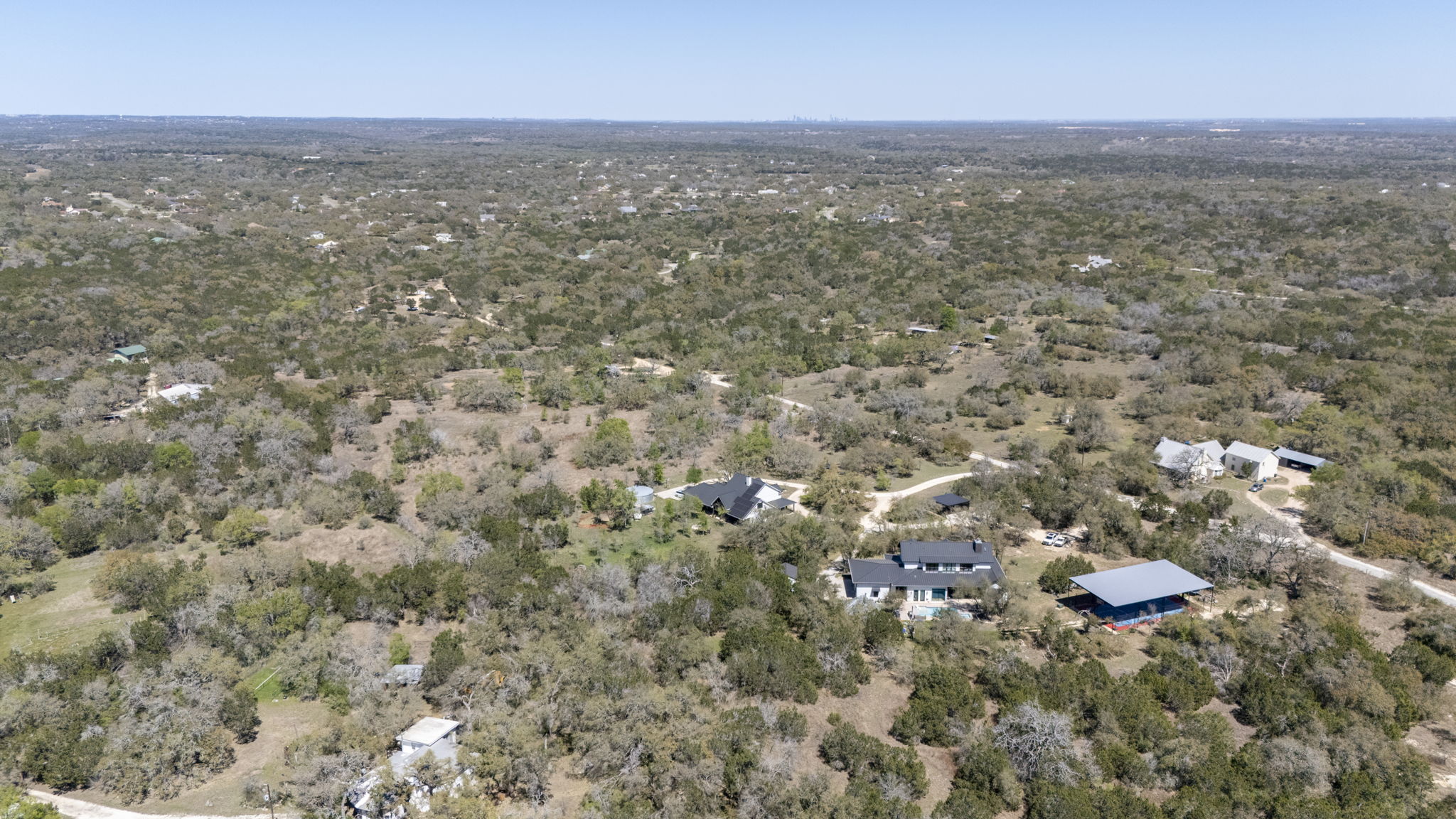 453 Nameless Road Driftwood, TX 78619 - Photo 7 of 35 an aerial view of residential houses with city view