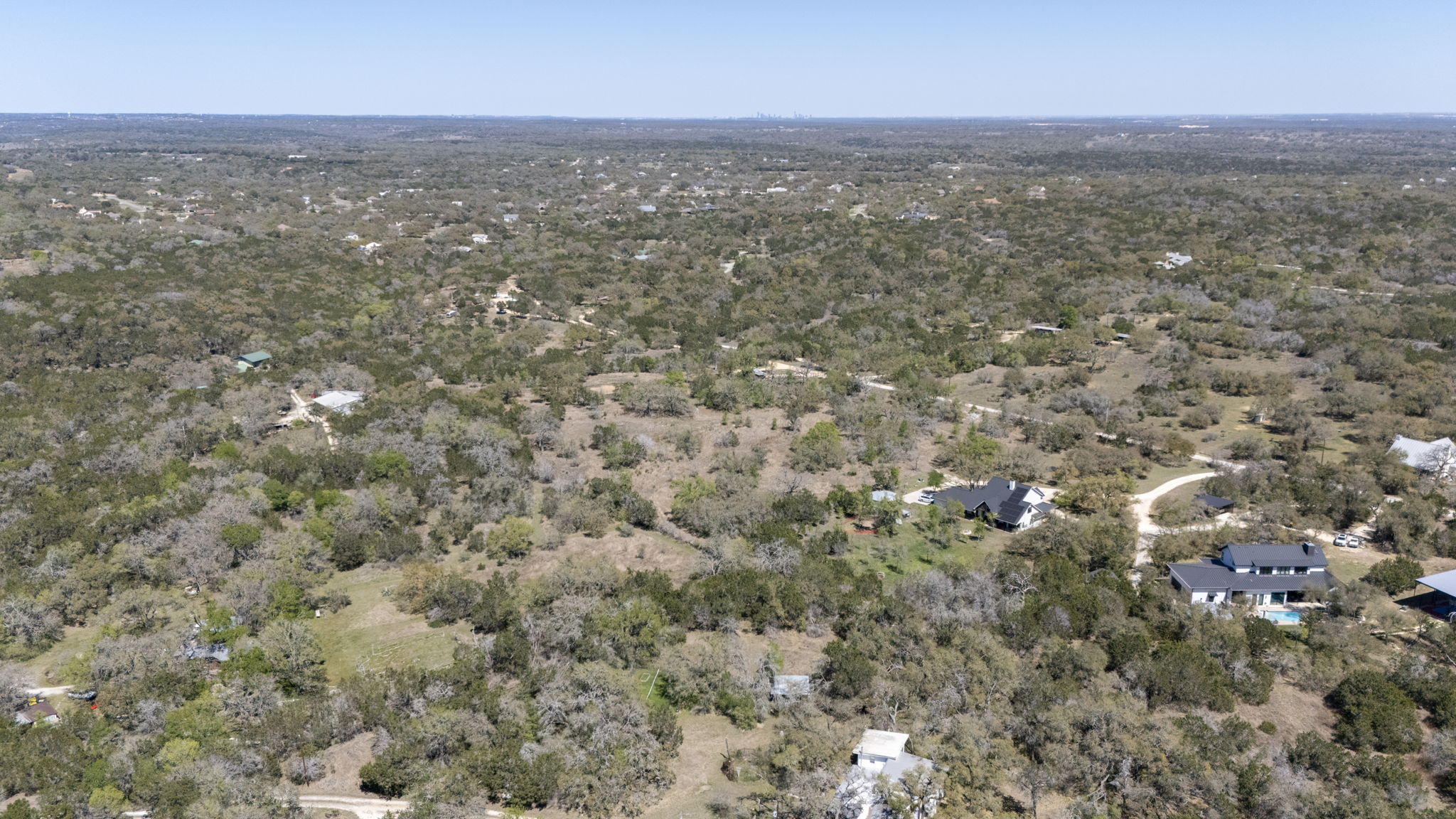 453 Nameless Road Driftwood, TX 78619 - Photo 8 of 35 an aerial view of residential houses with city view