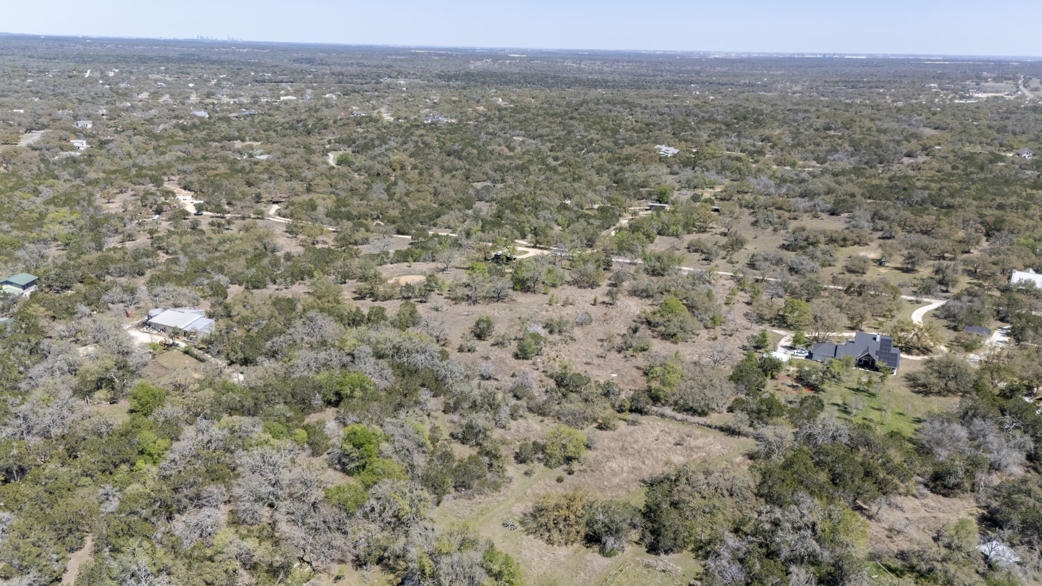 453 Nameless Road Driftwood, TX 78619 - Photo 10 of 35 a view of a big yard with houses