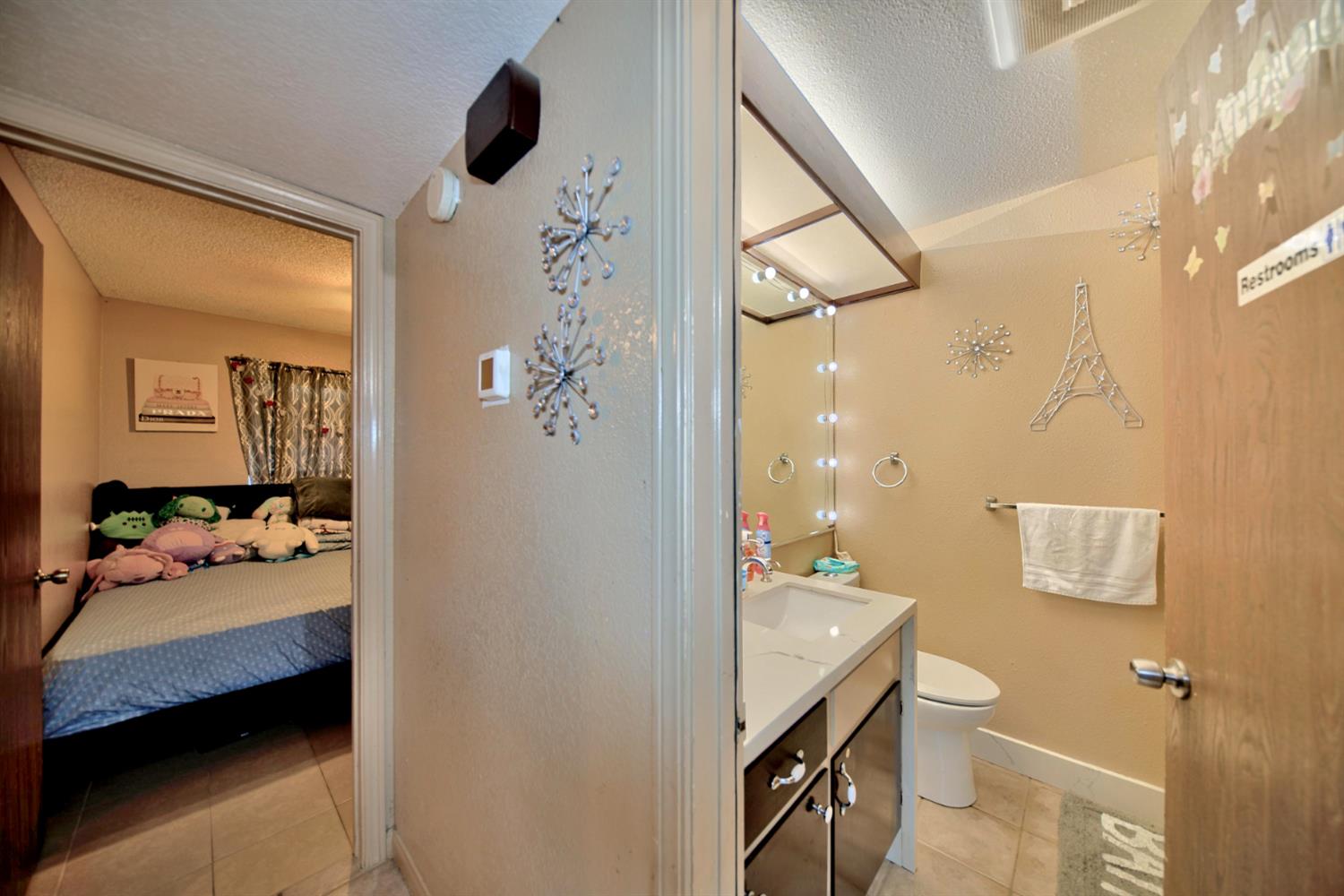 2013 Robertson Road Modesto, CA 95351 - Photo 8 of 24 a en suite bathroom with a granite countertop sink and a mirror
