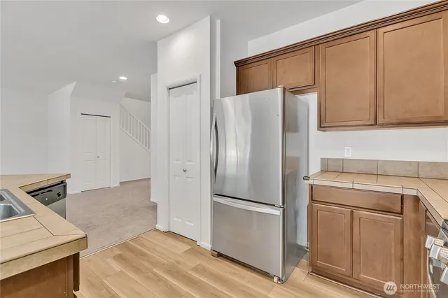 an empty room with sliding glass door and shower